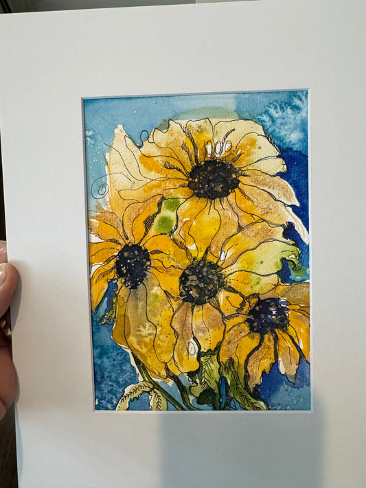 Black-eyed Susans on blue